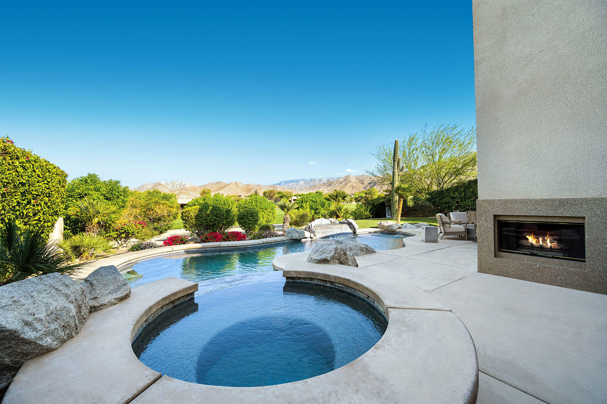 178 Wikil Place Palm Desert, CA 92260 - Photo 11 of 15 a view of a swimming pool with a patio and a yard