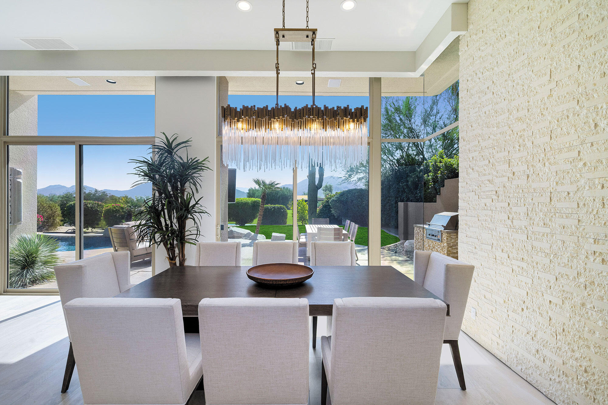 178 Wikil Place Palm Desert, CA 92260 - Photo 7 of 15 a dining room with furniture a chandelier and window
