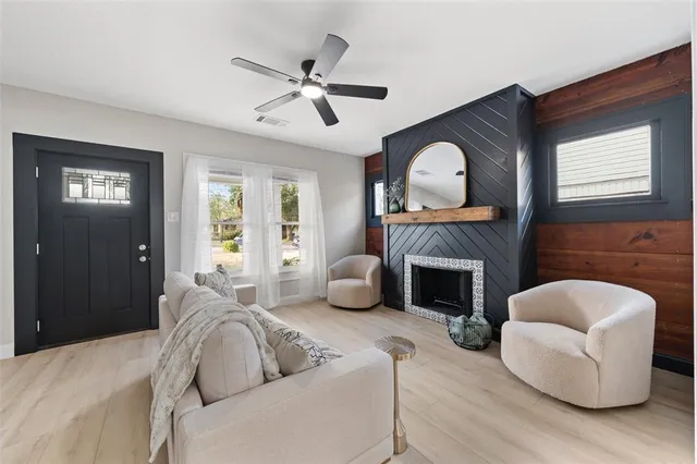a bedroom with furniture and a fireplace