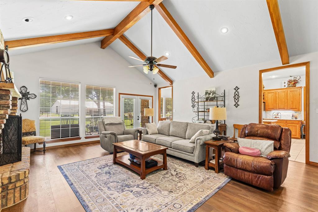 145 Indian Trail Decatur, TX 76234 - Photo 7 of 40 a living room with furniture a rug and a large window
