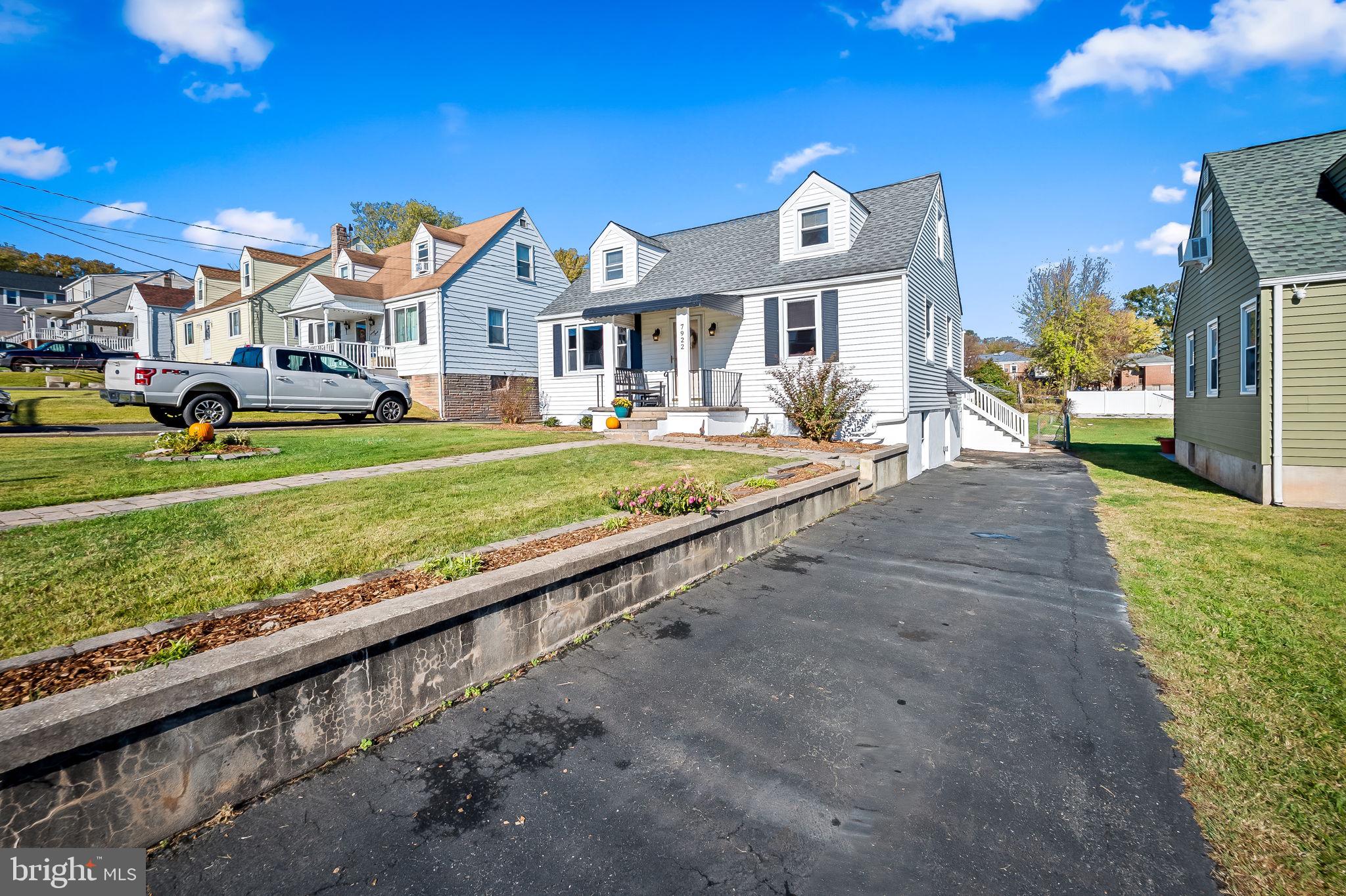 7922 Underhill Road Rosedale, MD 21237 - Photo 19 of 41 a front view of a house with a yard table and chairs
