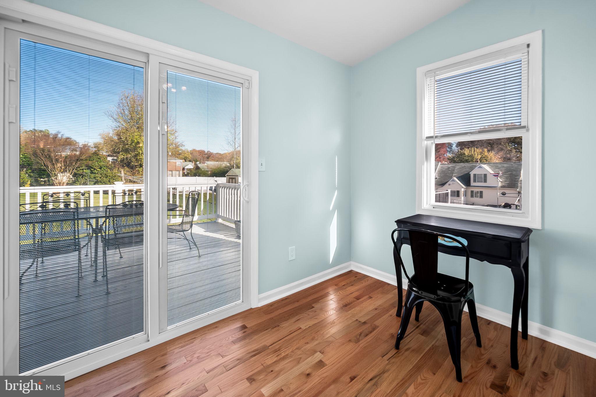 7922 Underhill Road Rosedale, MD 21237 - Photo 26 of 41 a view of a workspace with wooden floor and a dining table
