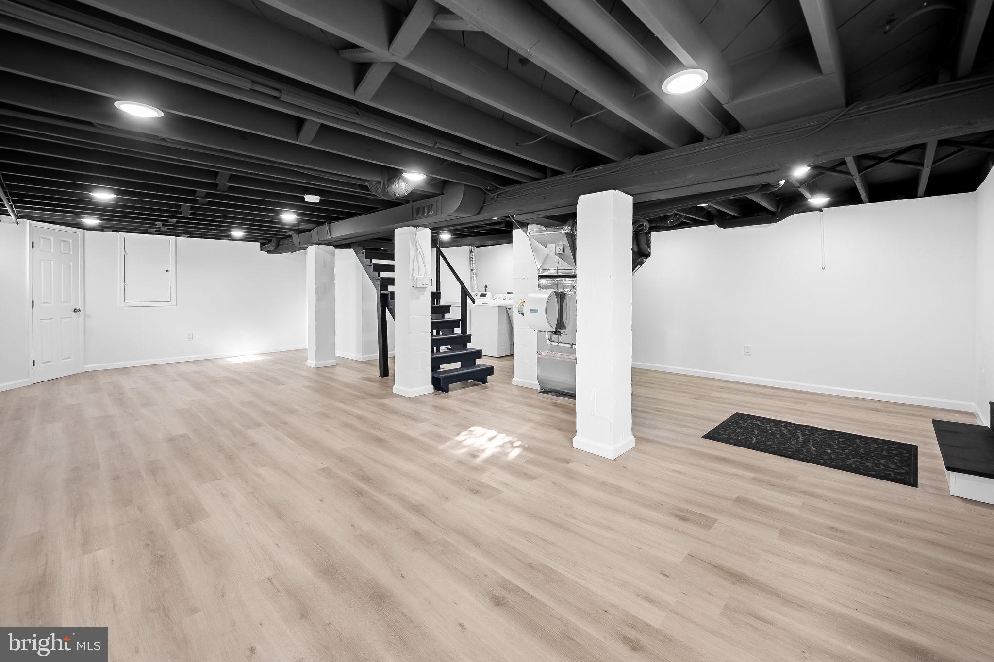 7922 Underhill Road Rosedale, MD 21237 - Photo 33 of 41 a view of water heater room with wooden floor