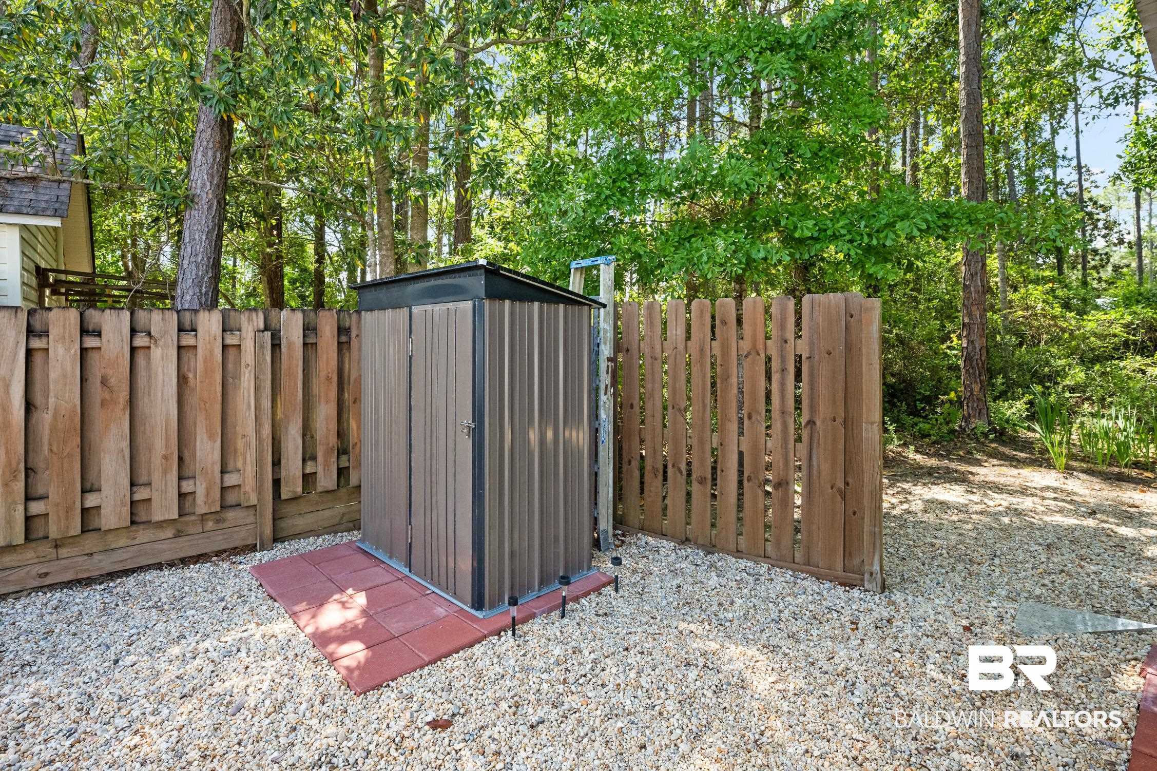 183 Defuniak Loop Lillian, AL 36549 - Photo 30 of 46 View of shed with fence