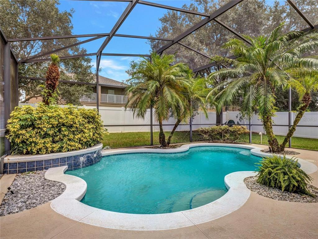 10023 Ians Ridge Road Orlando, FL 32832 - Photo 41 of 60 a view of swimming pool with a garden and plants