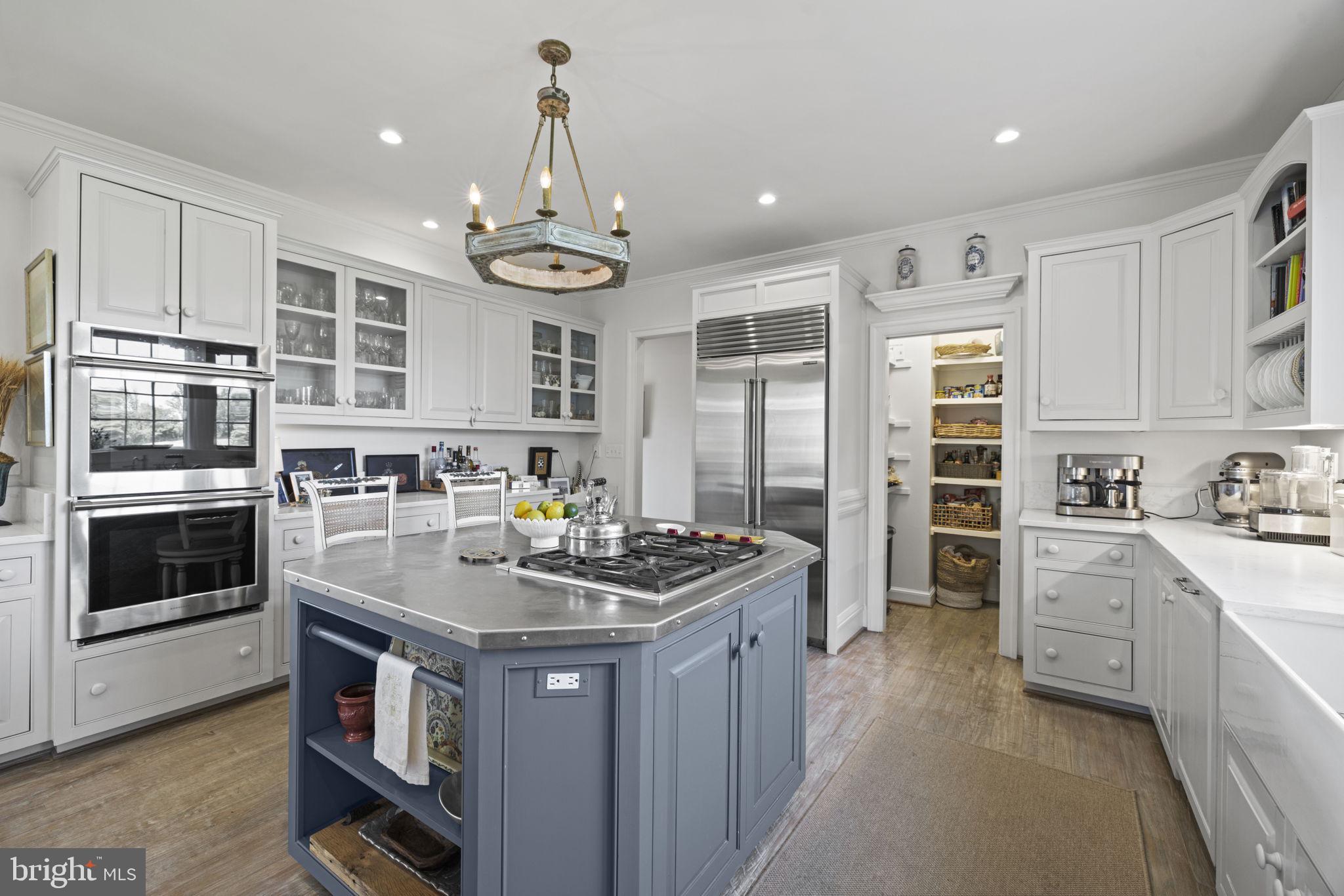 36190 Turkey Roost Road Middleburg, VA 20117 - Photo 23 of 88 a kitchen with stainless steel appliances granite countertop a stove and a sink
