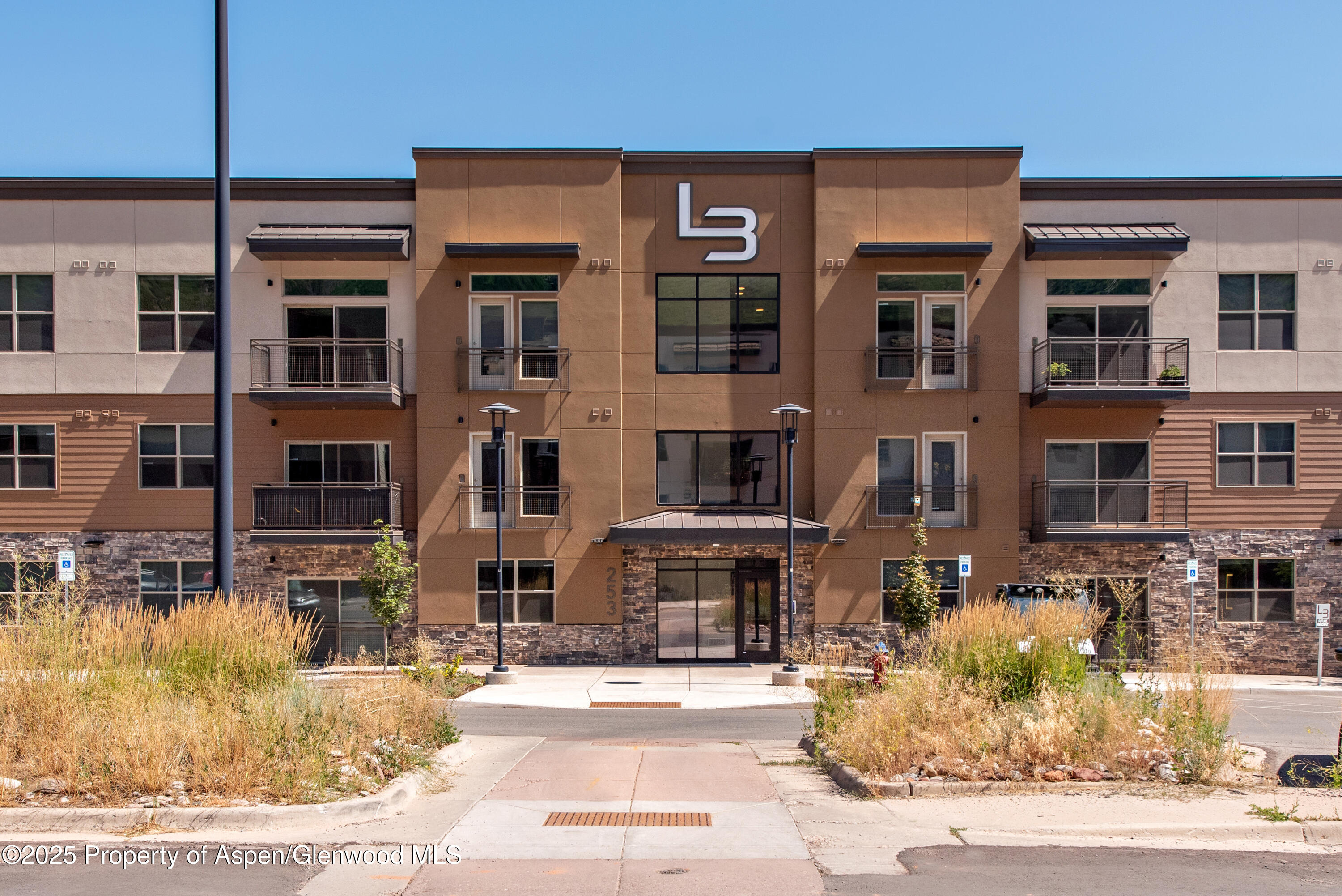 253 Wulfsohn Road, Unit 110 Glenwood Springs, CO 81601 - Photo 2 of 45 a front view of a building with street view
