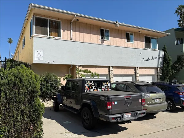a view of a car park in front of house