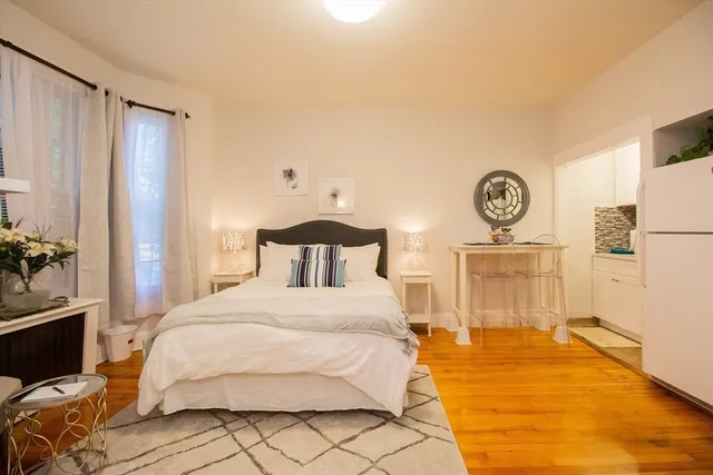 a spacious bedroom with a bed and a closet