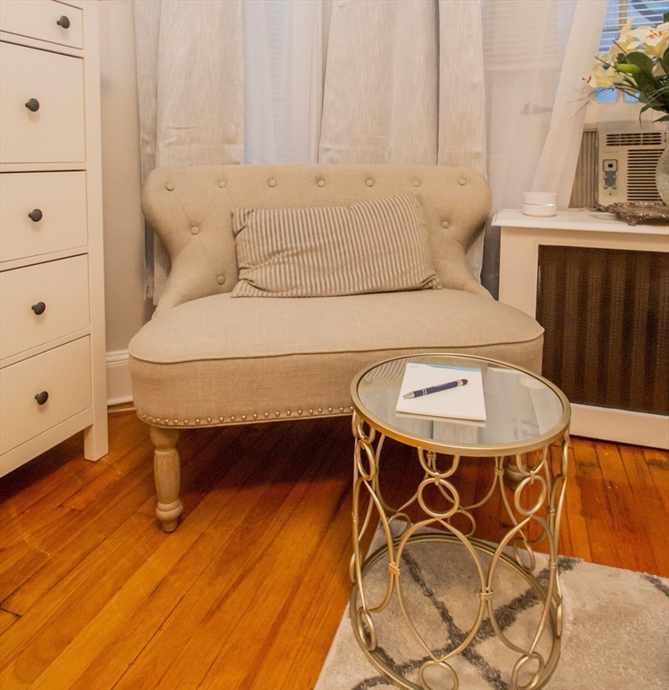 1253 Beacon Street, Unit A3 Brookline, MA 02446 - Photo 5 of 10 a bedroom with a bed and a dresser