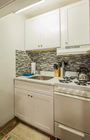 a bed room with a bed and a tv