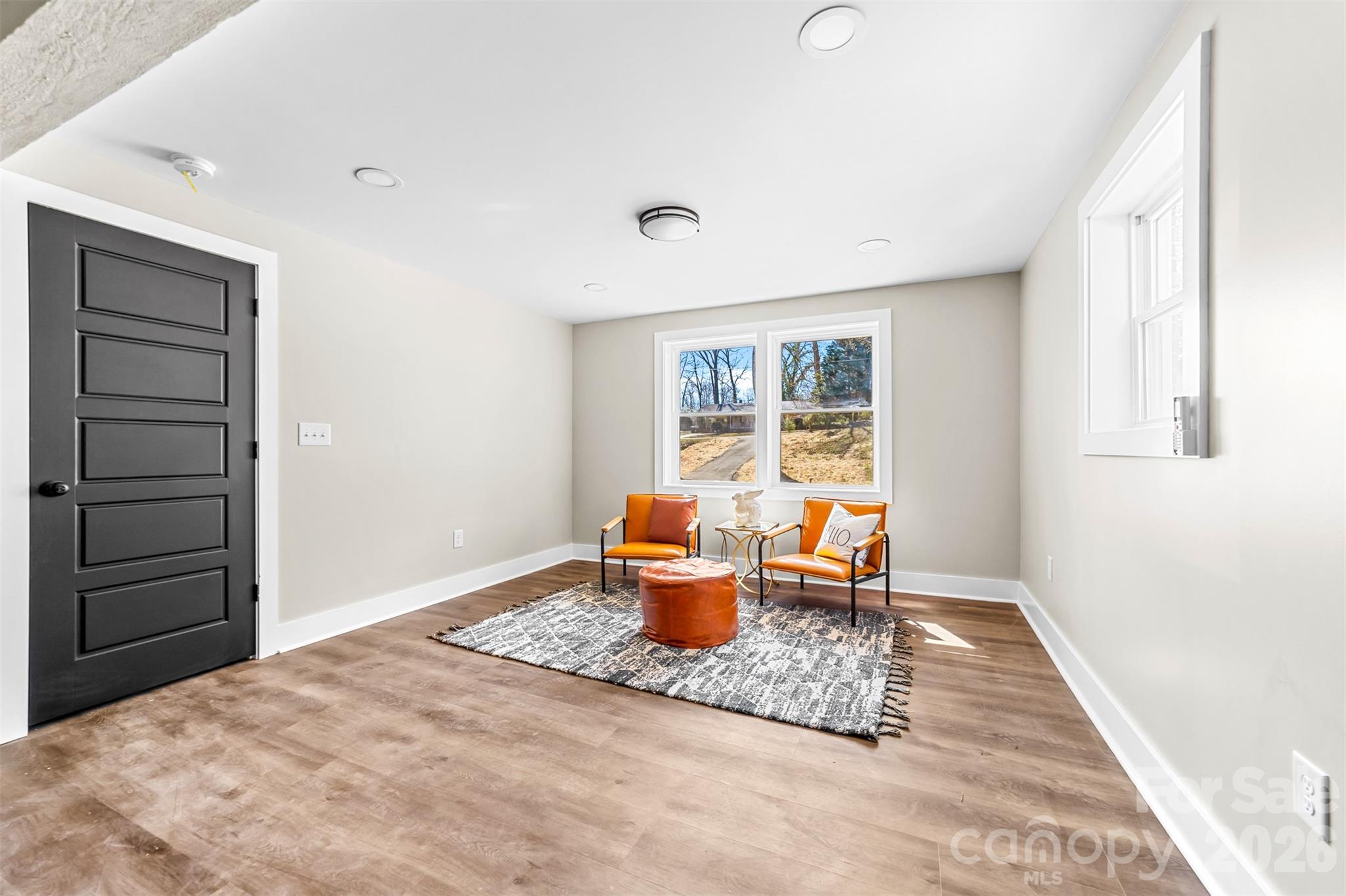 205 Redding Road Stanley, NC 28164 - Photo 27 of 34 a living room with furniture and a window