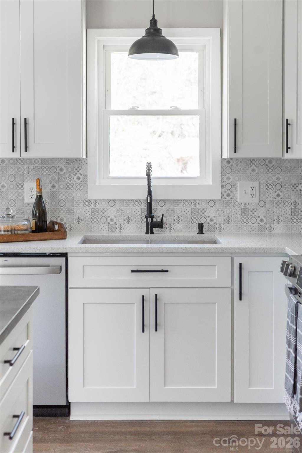 205 Redding Road Stanley, NC 28164 - Photo 8 of 34 a kitchen with white cabinets and a window