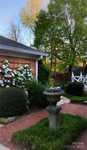 a kitchen with stainless steel appliances granite countertop sink stove top oven and cabinets