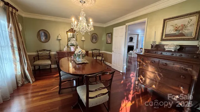 a white toilet sitting next to a shower