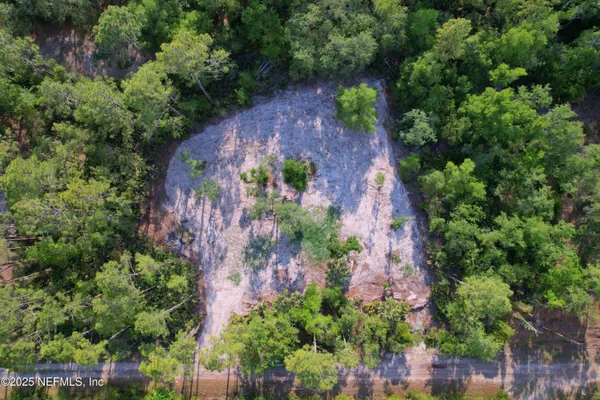 an aerial view of residential house with outdoor space