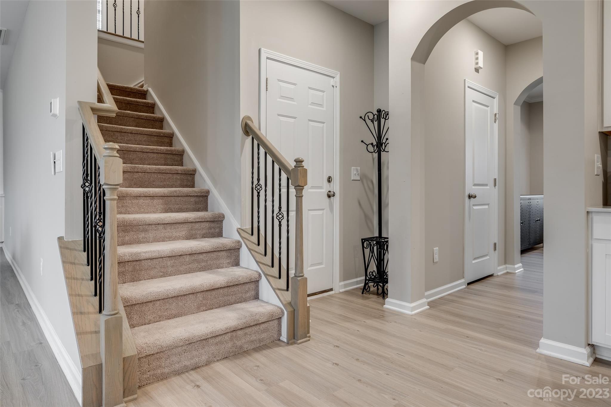 1656 Corwin Bend Road Tega Cay, SC 29708 - Photo 25 of 47 a view of a hallway with wooden floor and entryway