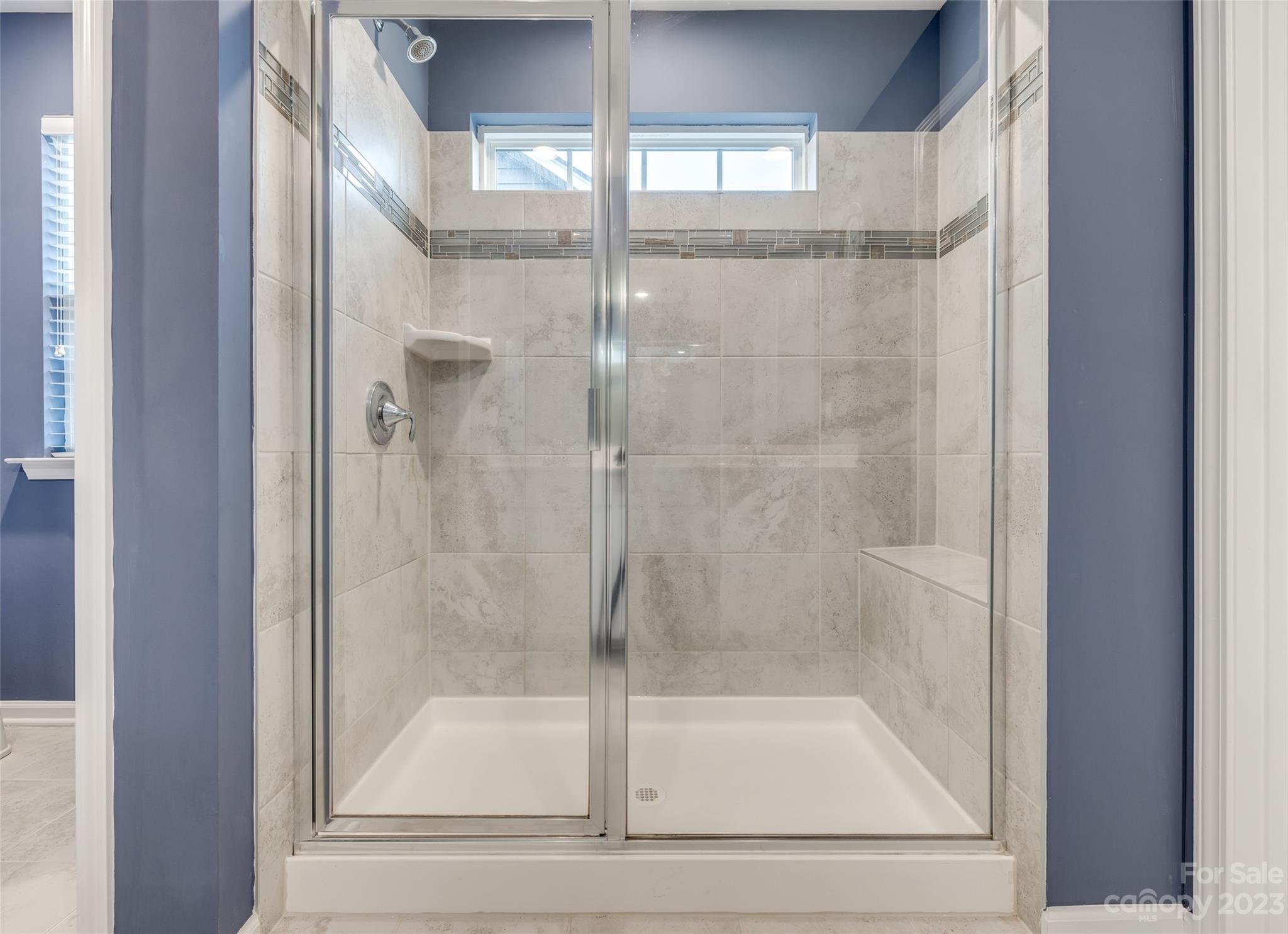 1656 Corwin Bend Road Tega Cay, SC 29708 - Photo 34 of 47 a bathroom with a glass shower door