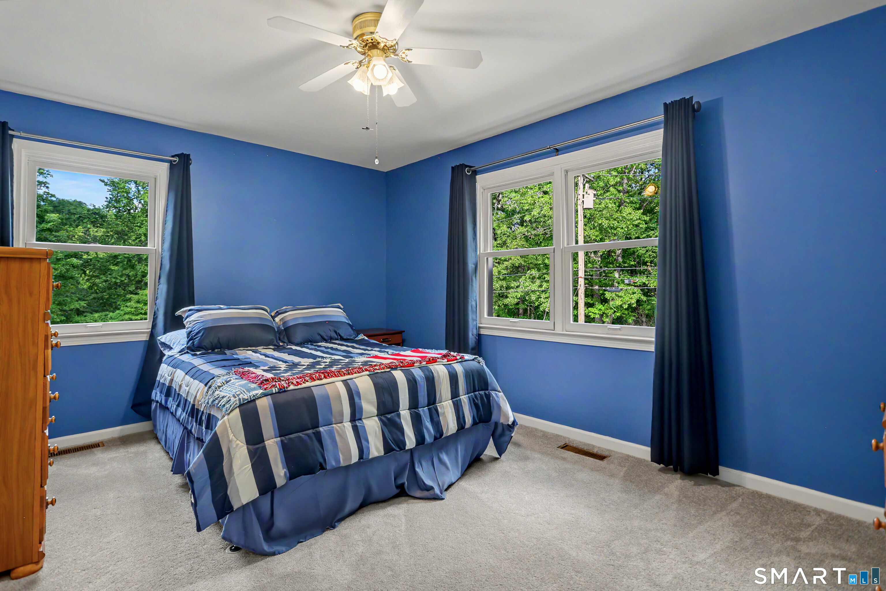 632 Wheelers Farm Road Orange, CT 06477 - Photo 20 of 39 a bed sitting in a bedroom next to a window