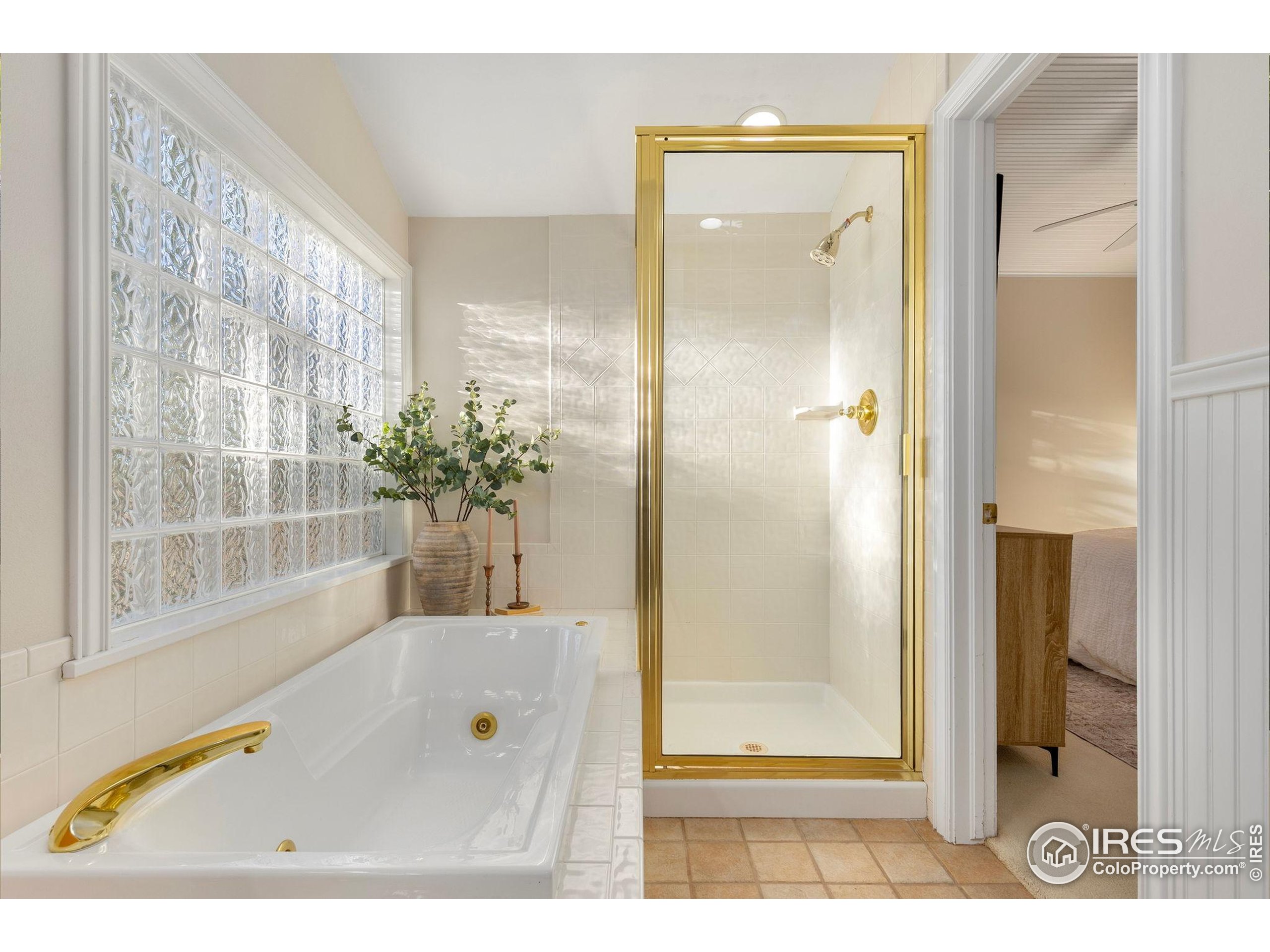 961 5th Street Berthoud, CO 80513 - Photo 13 of 35 a view of a bathroom with a glass door