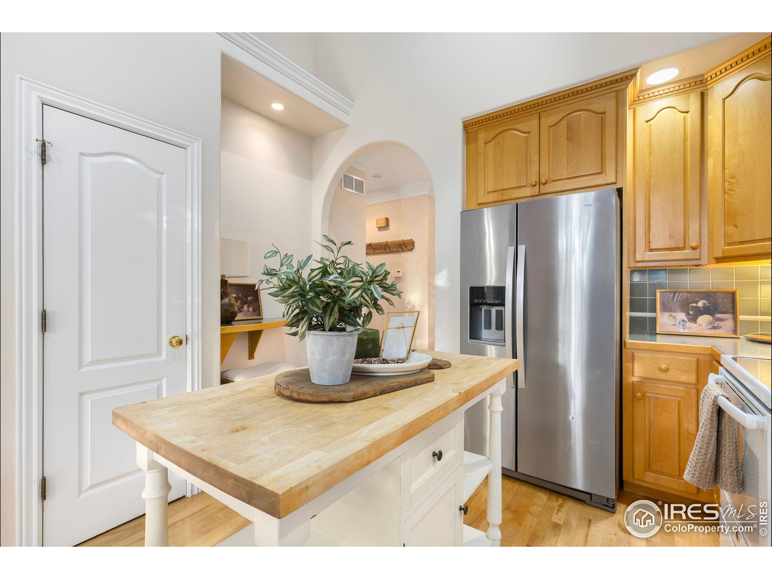 961 5th Street Berthoud, CO 80513 - Photo 15 of 35 a kitchen with stainless steel appliances granite countertop a refrigerator a stove and a sink