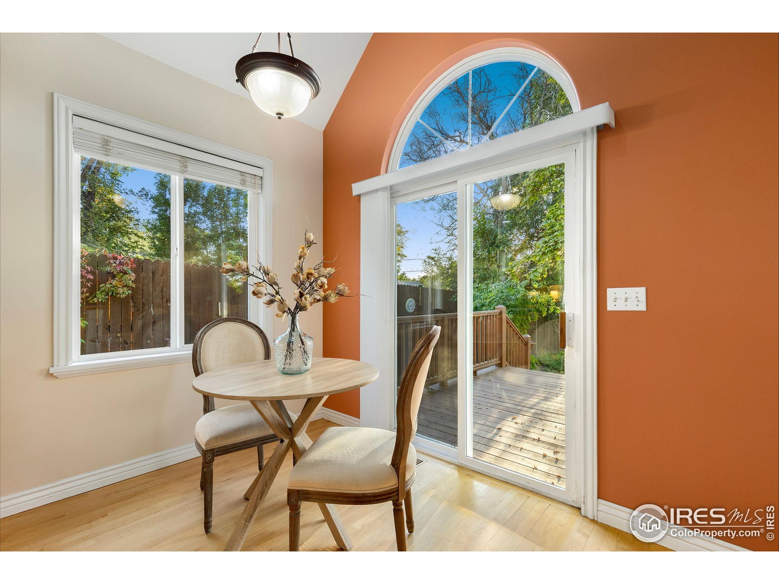 961 5th Street Berthoud, CO 80513 - Photo 18 of 35 a view of a dining room with furniture wooden floor and a carpet