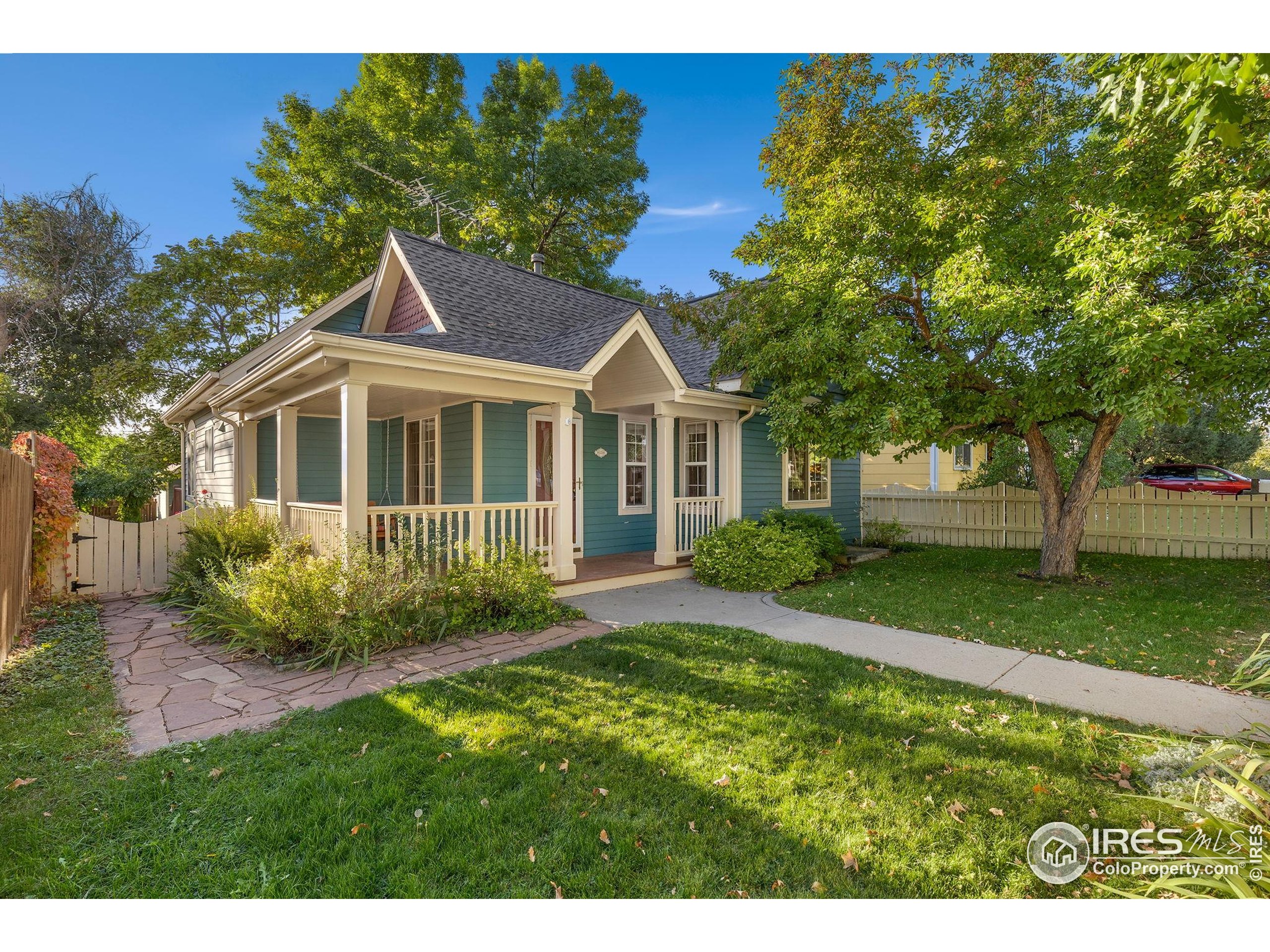 961 5th Street Berthoud, CO 80513 - Photo 2 of 35 a front view of a house with a yard