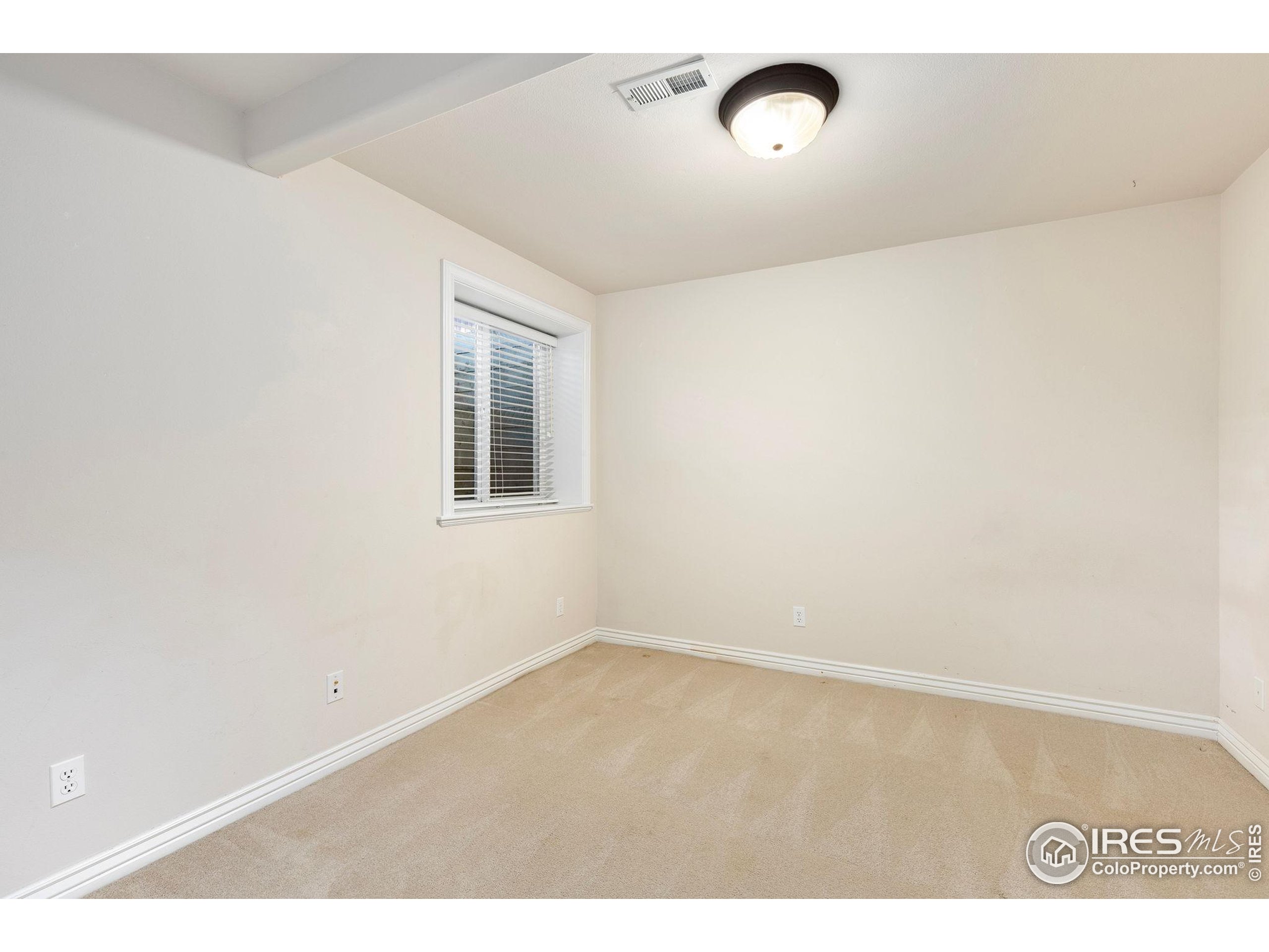 961 5th Street Berthoud, CO 80513 - Photo 24 of 35 an empty room with a window