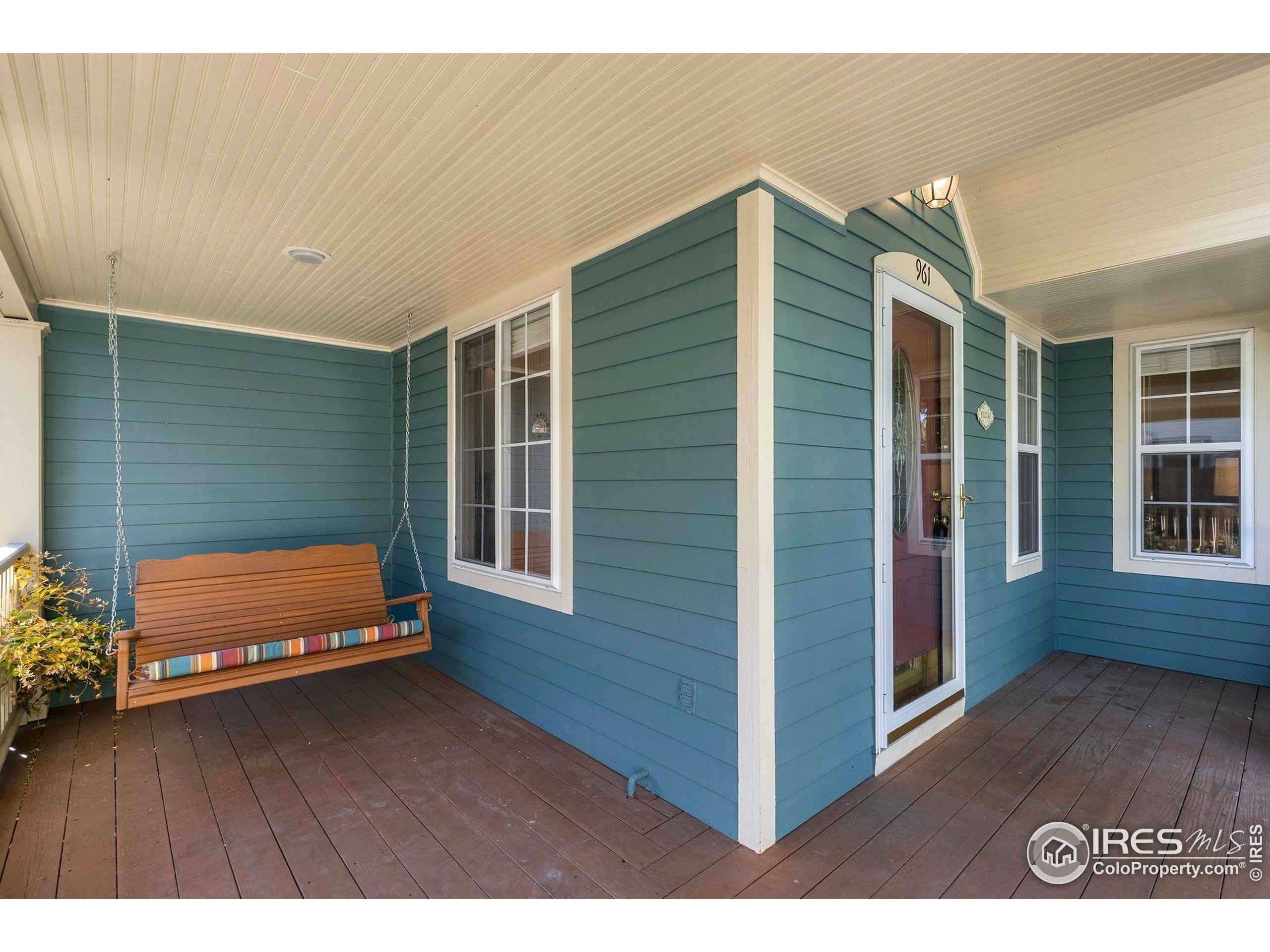 961 5th Street Berthoud, CO 80513 - Photo 28 of 35 a balcony with hardwood