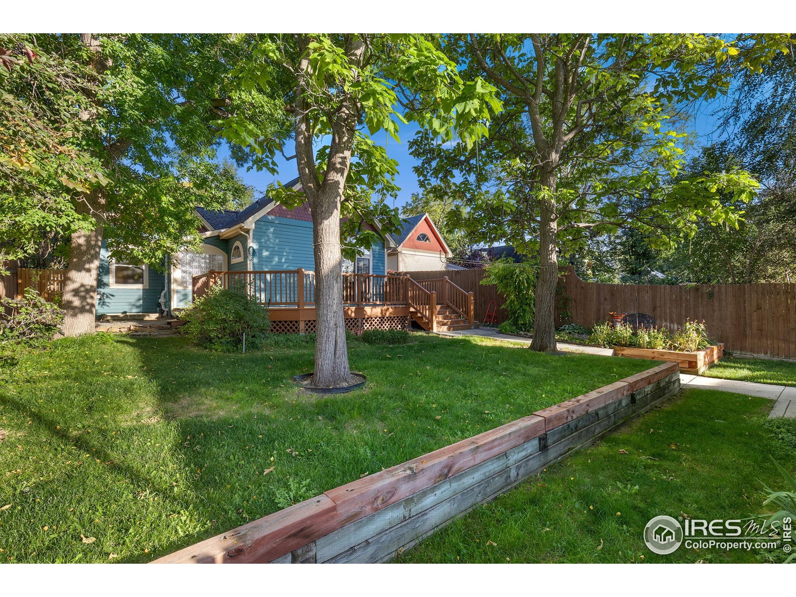 961 5th Street Berthoud, CO 80513 - Photo 30 of 35 a backyard of a house with lots of green space
