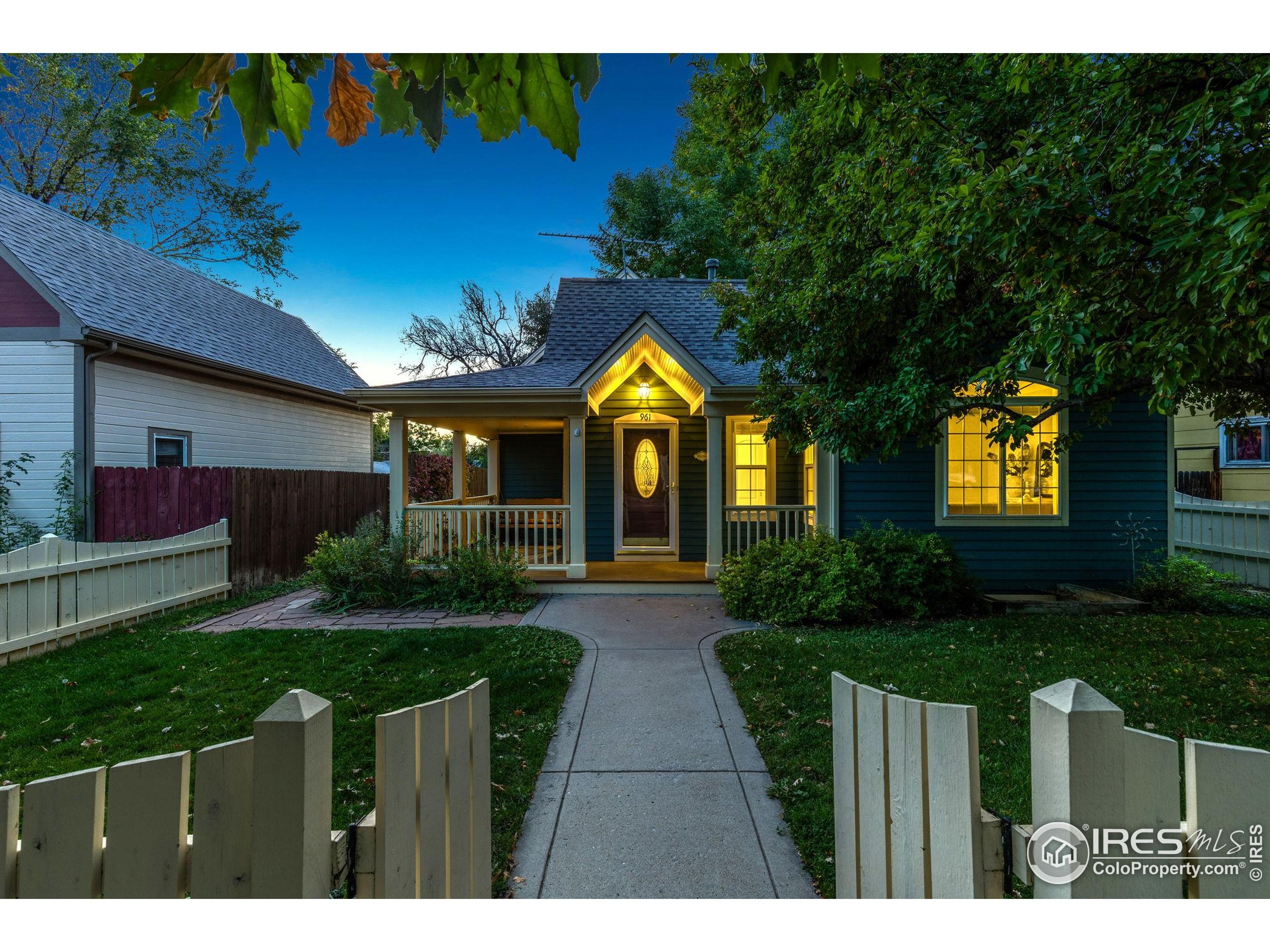 961 5th Street Berthoud, CO 80513 - Photo 31 of 35 a front view of house with yard and green space