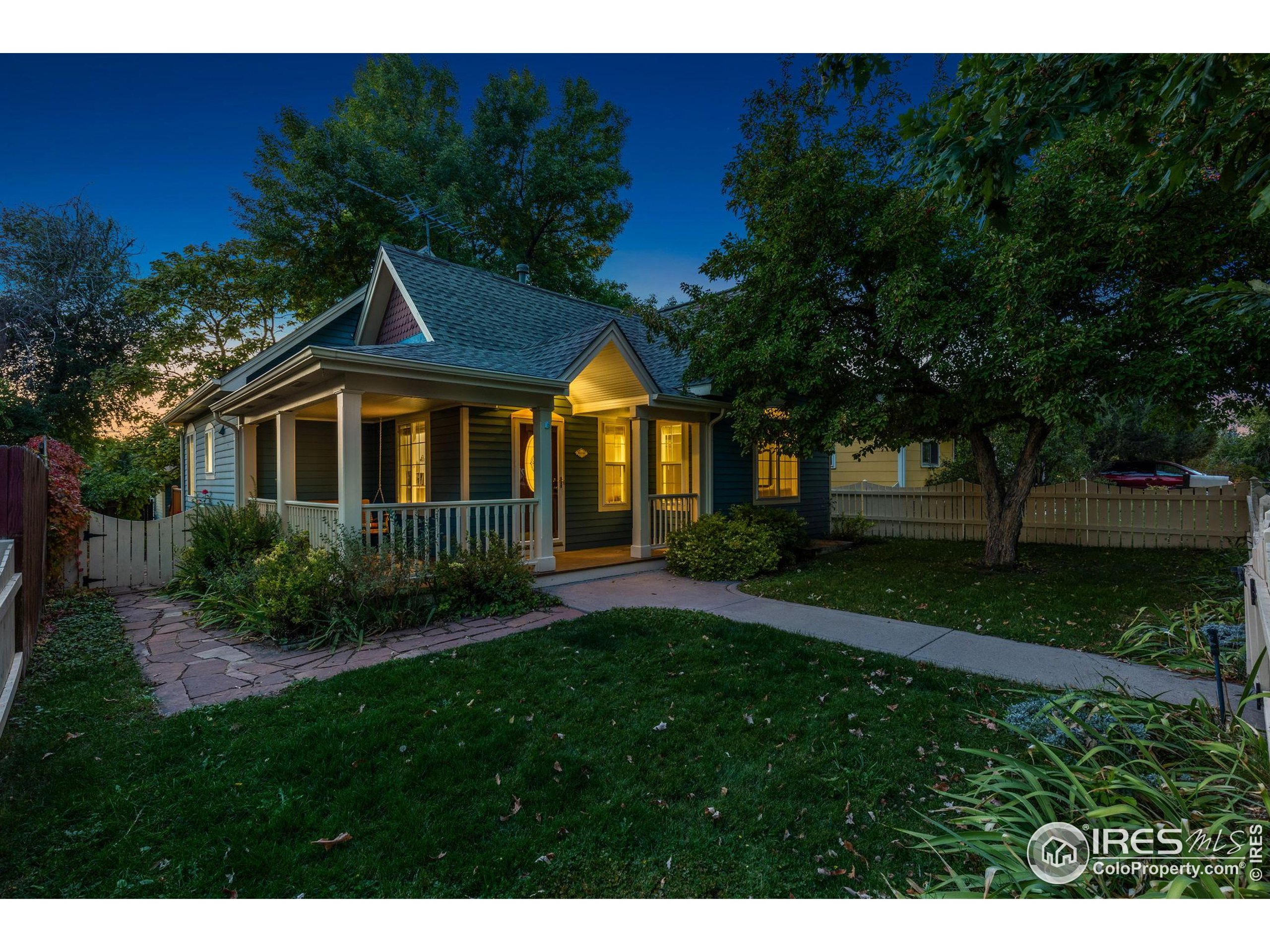 961 5th Street Berthoud, CO 80513 - Photo 32 of 35 a front view of a house with a yard