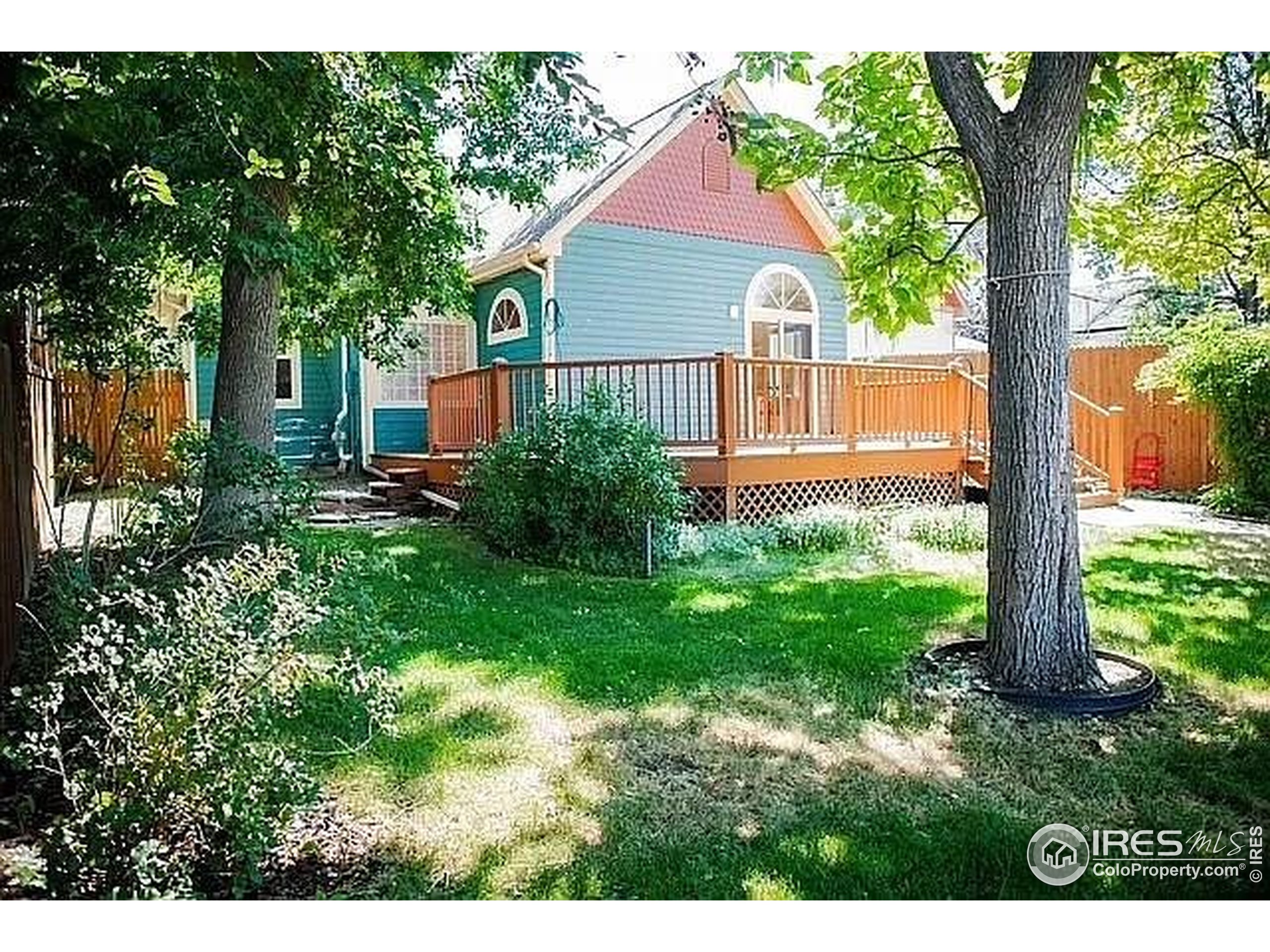 961 5th Street Berthoud, CO 80513 - Photo 34 of 35 a front view of a house with garden