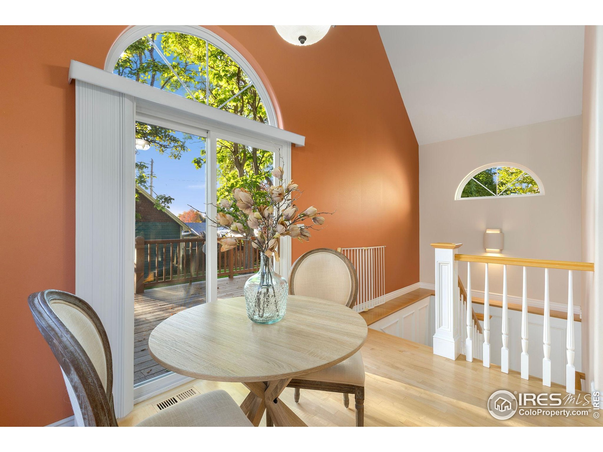 961 5th Street Berthoud, CO 80513 - Photo 9 of 35 a dining room with furniture and wooden floor