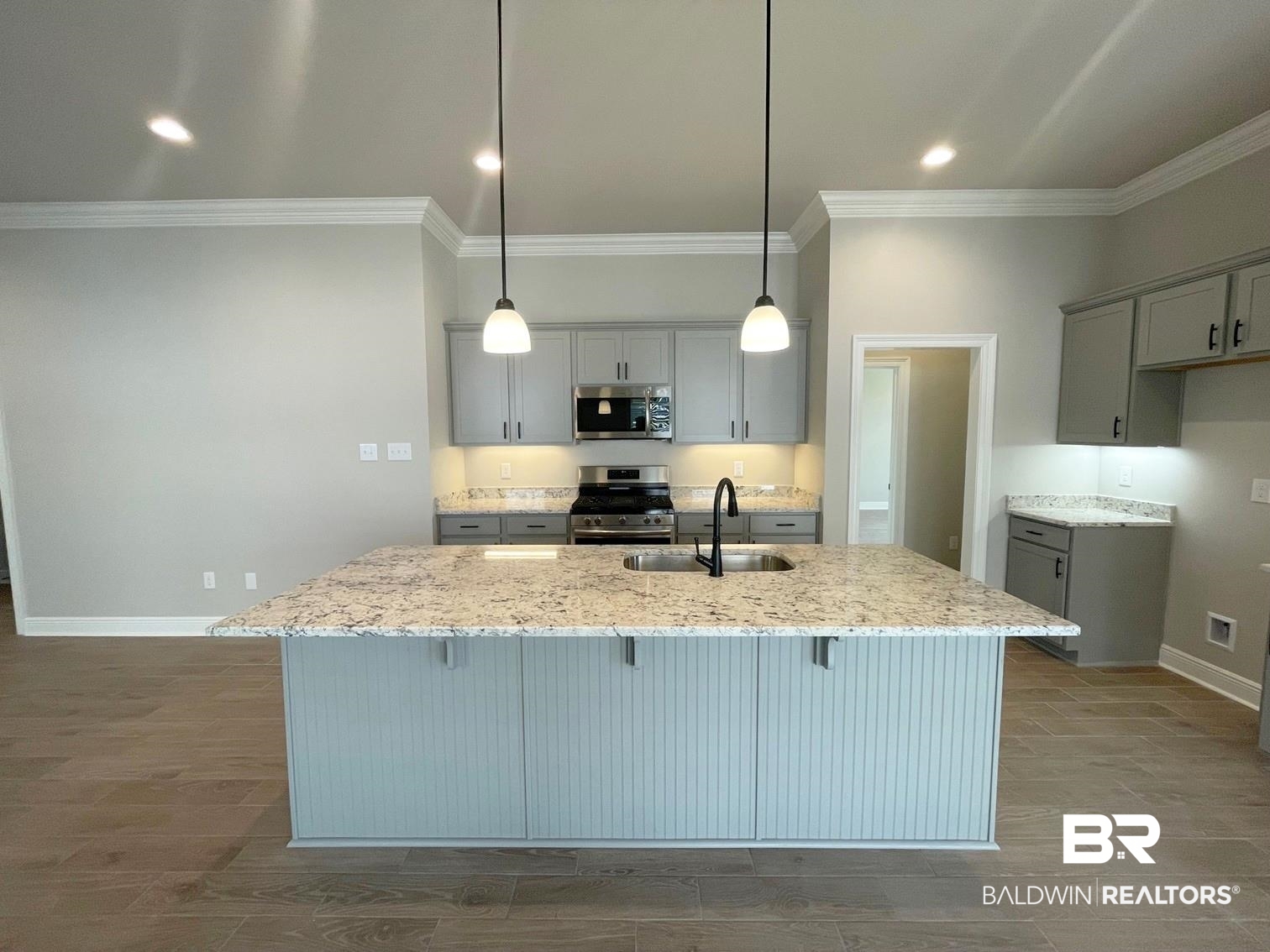 1355 Fenton Circle Foley, AL 36535 - Photo 3 of 17 Kitchen featuring gray cabinets, light stone countertops, sink, and stainless steel appliances