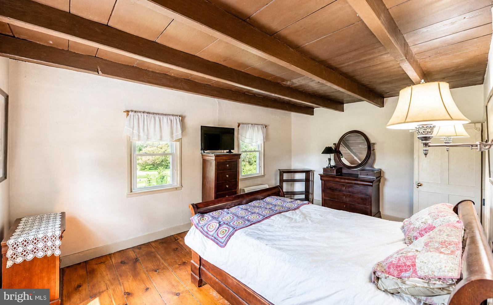 222 Blue School Road Perkasie, PA 18944 - Photo 32 of 77 a bedroom with a bed dresser and a window