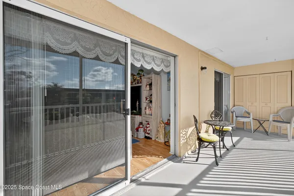 a view of a balcony with chairs