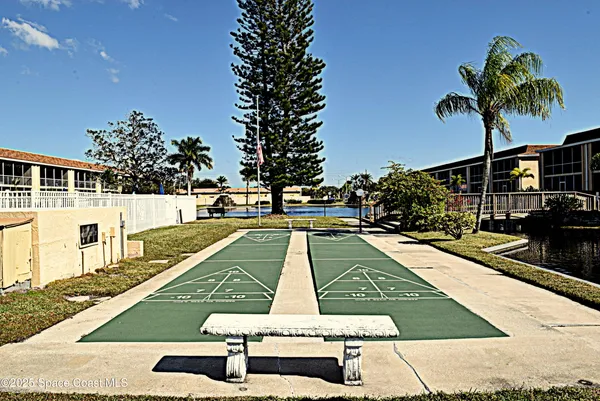 a view of swimming pool with chairs