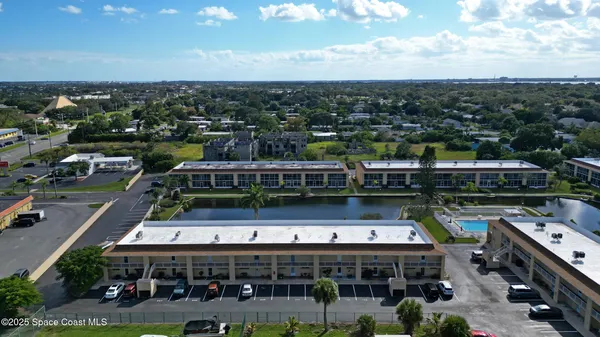 a balcony with furniture and city view