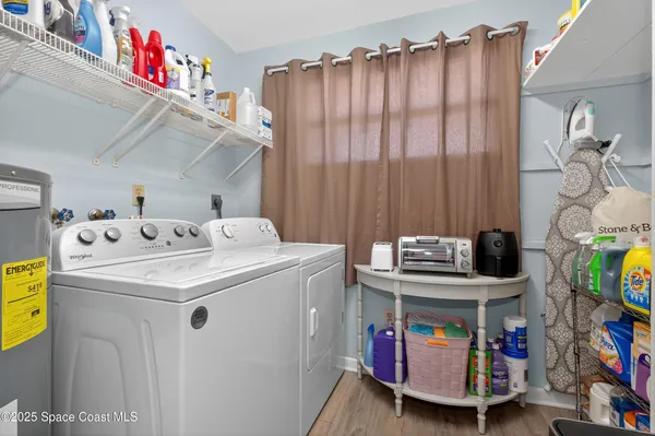 a utility room with dryer and washer