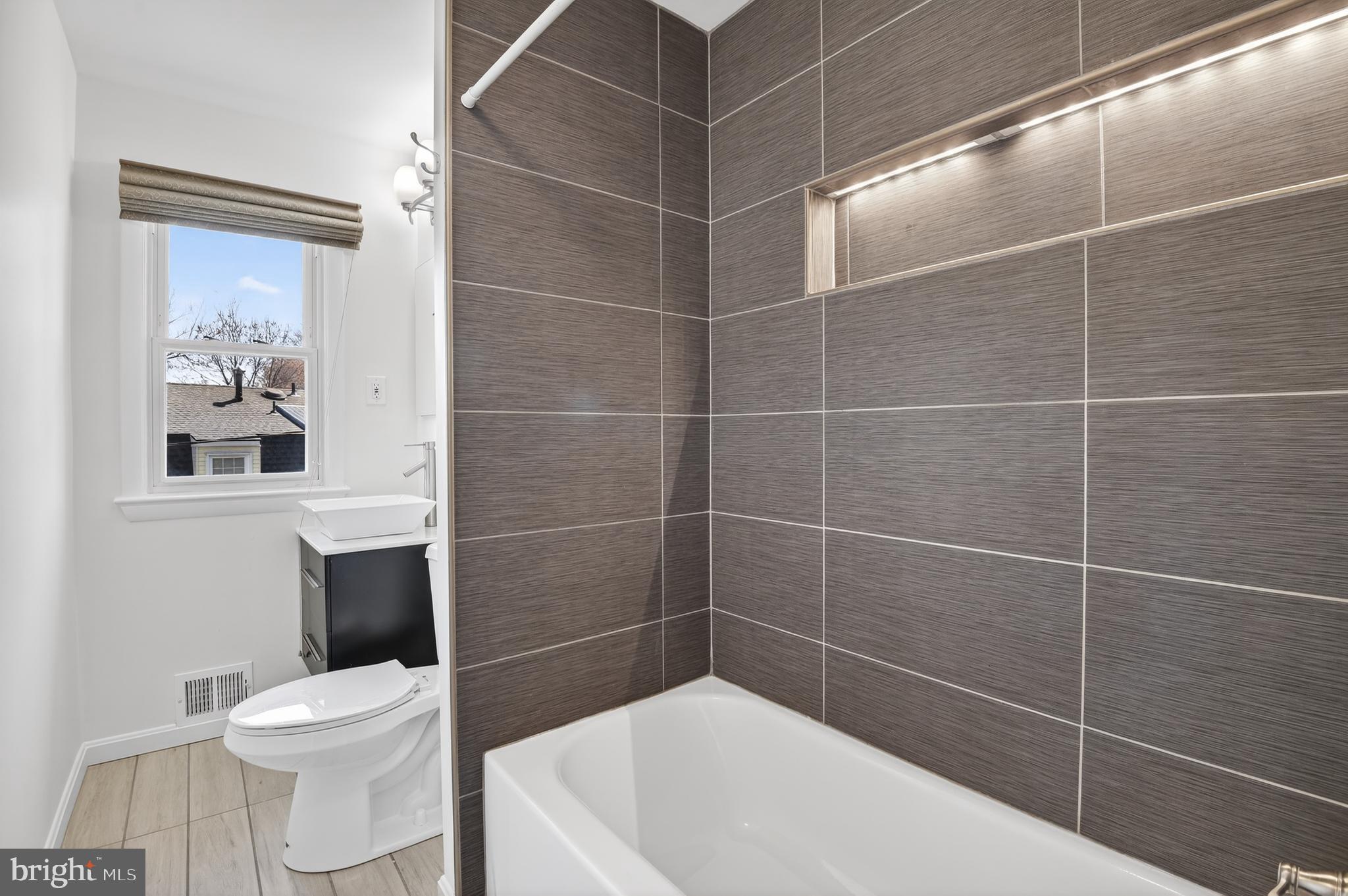 11004 Oakwood Street Silver Spring, MD 20901 - Photo 23 of 35 a bathroom with a toilet and a sink