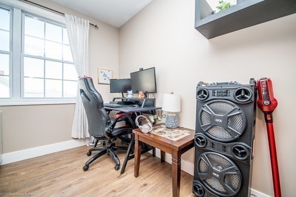 303 Eagle Street, Unit D Fall River, MA 02721 - Photo 20 of 24 a view of a workspace with furniture and a window