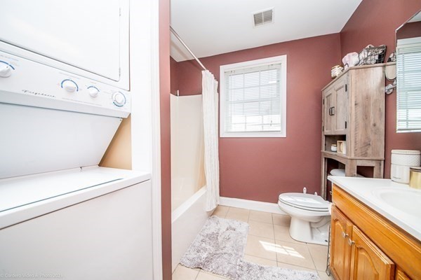 303 Eagle Street, Unit D Fall River, MA 02721 - Photo 21 of 24 a bathroom with a sink a toilet and shower