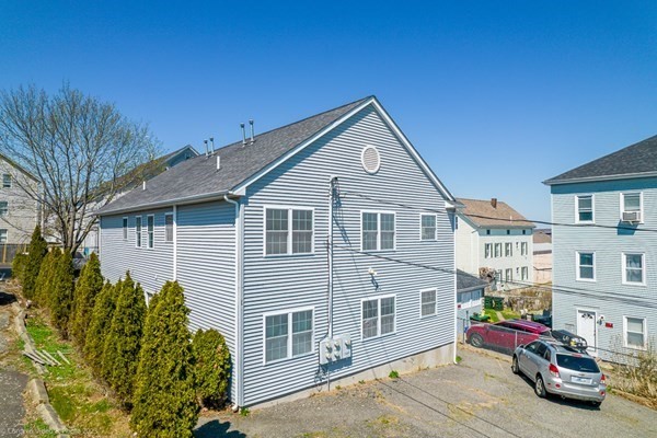 303 Eagle Street, Unit D Fall River, MA 02721 - Photo 3 of 24 a view of a house with a cars park