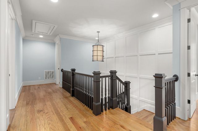 a view of a hallway with a hardwood floor