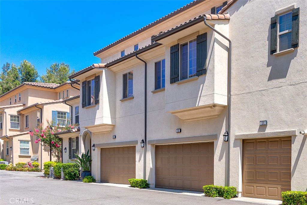 135 Silverado Irvine, CA 92618 - Photo 18 of 23 a front view of a house with garage and plants