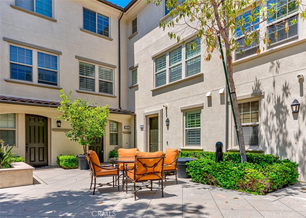 135 Silverado Irvine, CA 92618 - Photo 20 of 23 a wooden bench sitting in front of a building