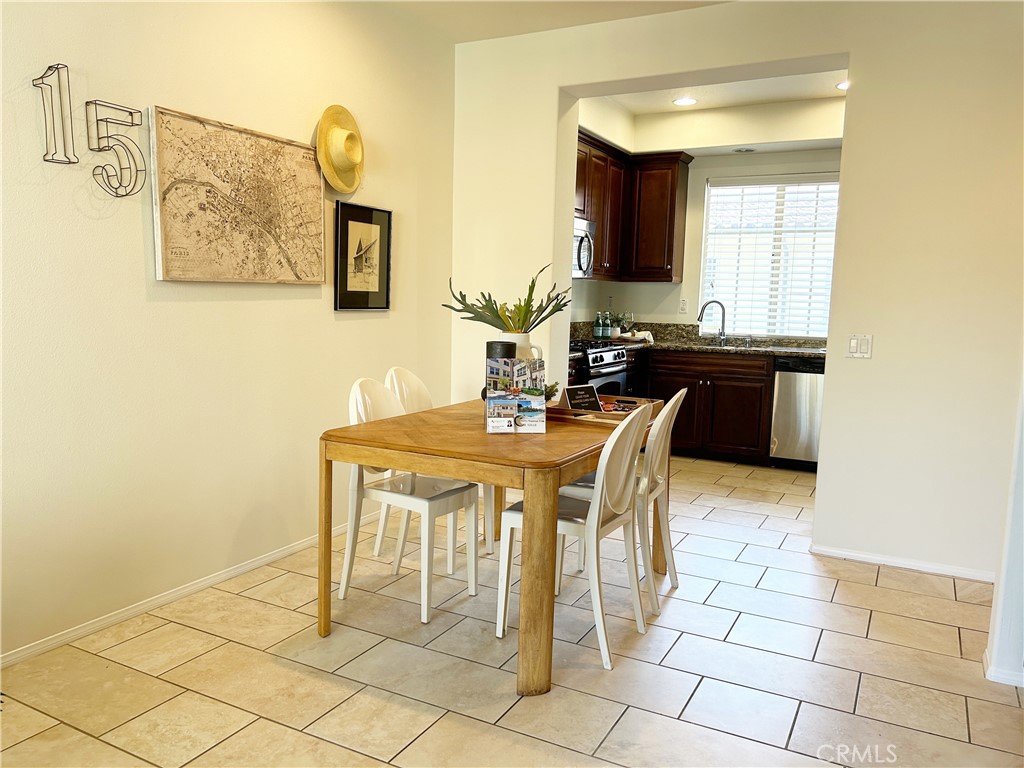 135 Silverado Irvine, CA 92618 - Photo 6 of 23 a dining hall with a sink and a mirror
