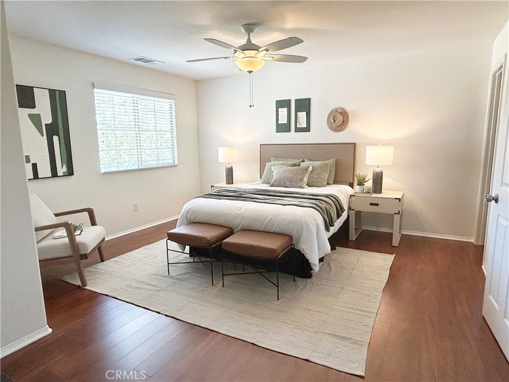 135 Silverado Irvine, CA 92618 - Photo 10 of 23 a bedroom with a bed and a chandelier