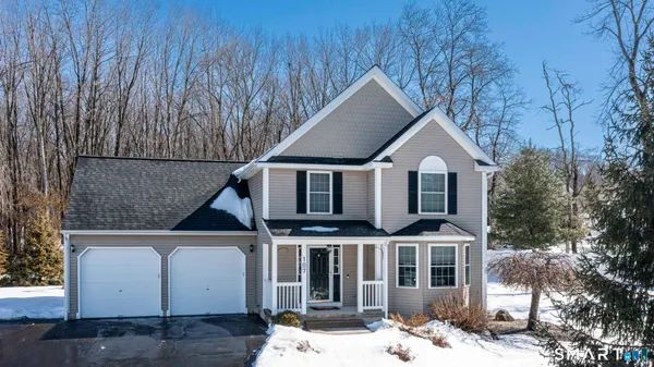 a view of house with yard